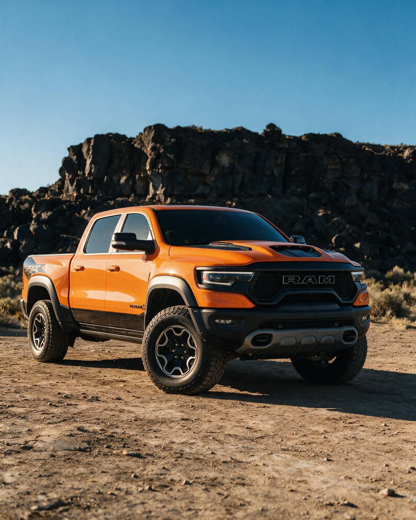 Ram 1500 TRX photographed front three-quarter on desert terrain