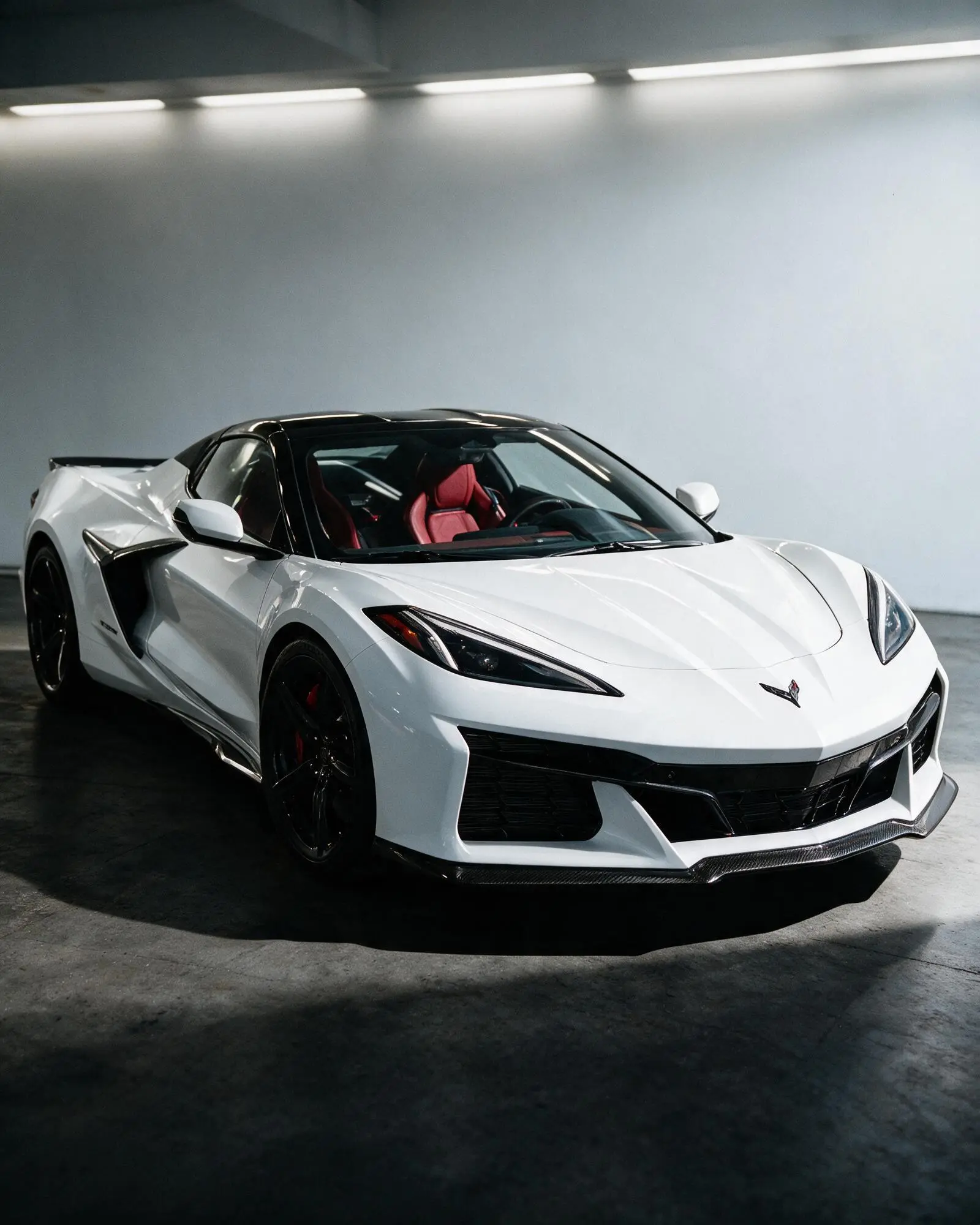 Chevrolet Corvette (C8) photographed front three-quarter in a studio