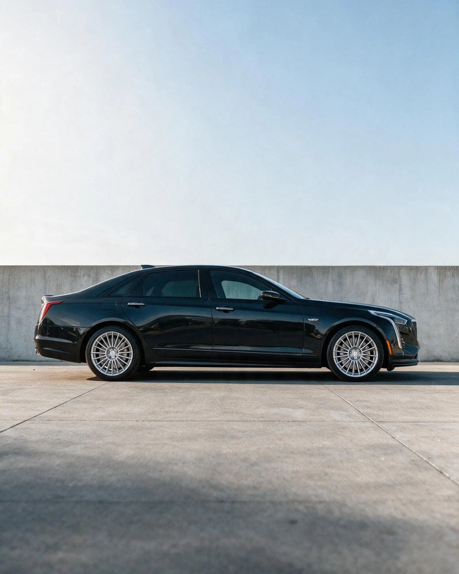 Cadillac V-Series Blackwing photographed in profile against a concrete wall